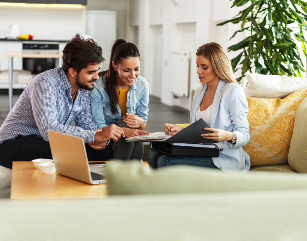 happy couple meeting with their homebuilder