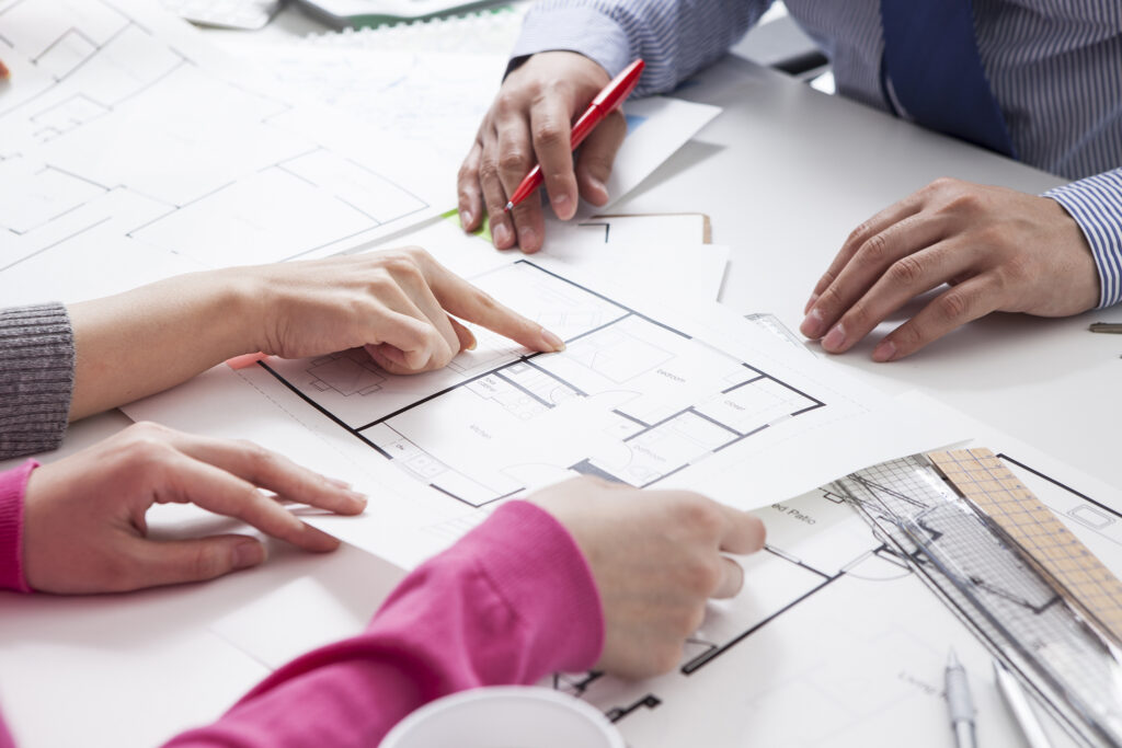 homebuilders hands over house blueprint